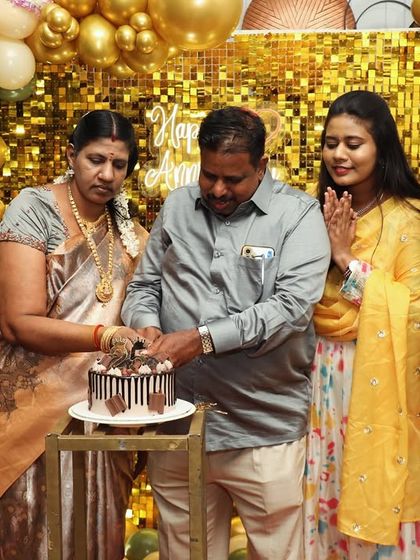 A heartwarming moment of the family cutting the cake together. We love capturing these precious memories for our clients.