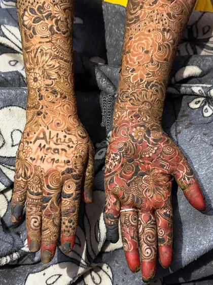 "Akhir Maan Hi Gaye" (They finally agreed). This fun, personalized design shows a beautiful transition from a fresh red stain to a deeper color.
