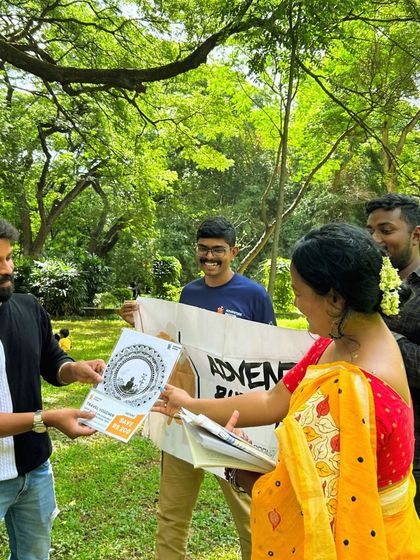 Another shot of our community members receiving goodies and connecting at our park event.