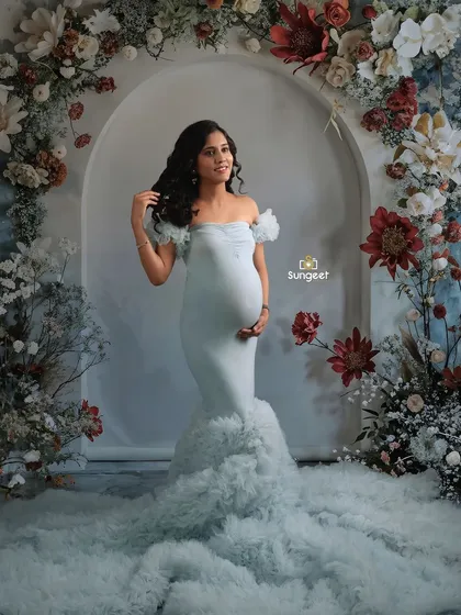 A slightly different angle of the floral arch setup, capturing a candid, happy expression.