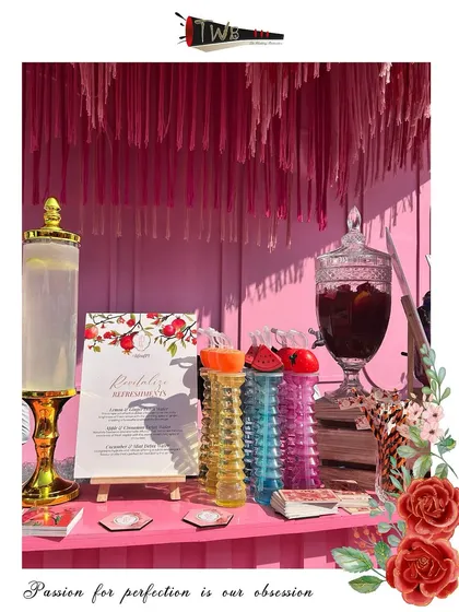Another angle of the stunning pink brunch bar, showcasing the beverage dispensers and themed decor.