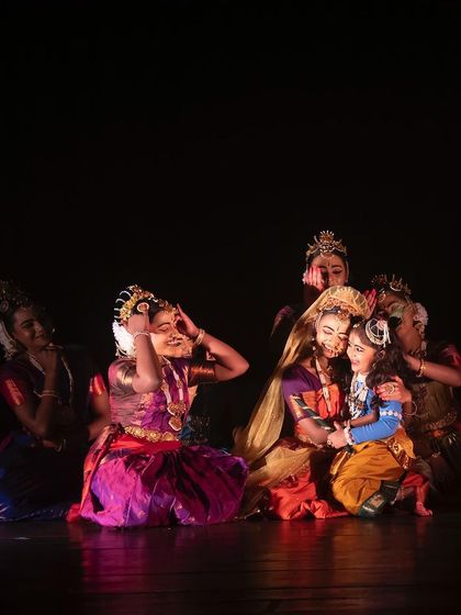A heartwarming group scene from "KRISHNA", showing the affection between Yashoda and the gopis for the young lord. These moments of tenderness are central to the story.