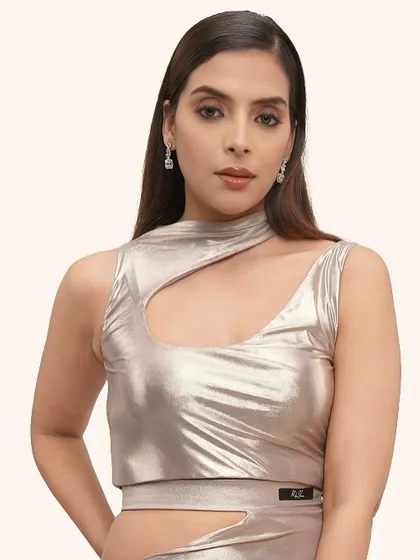 This is a perfect example of editorial makeup for a high-fashion brand. The look is clean and modern, with a focus on flawless, radiant skin that complements the metallic fabric of the outfit. It's about creating a subtle pop that elevates the entire aesthetic.