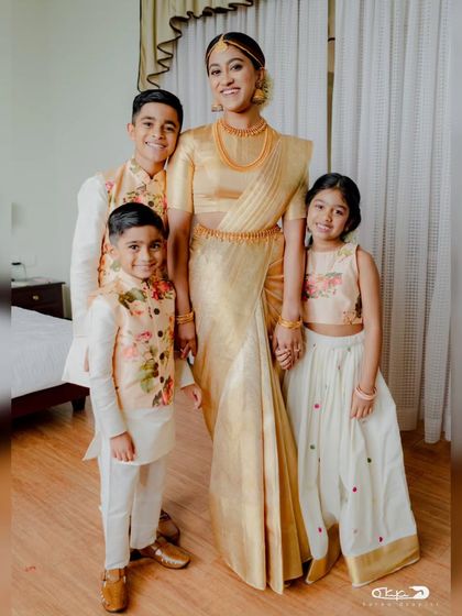 A beautiful bride with her younger family members. My draping ensures she can move around and enjoy these precious moments with ease.