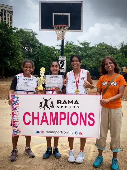 Another group of champions holding their trophy and certificates high. We help teams celebrate their success on the court.