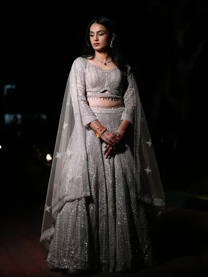 A stunning portrait of the bride in her glittering Sangeet lehenga, ready to set the stage on fire.