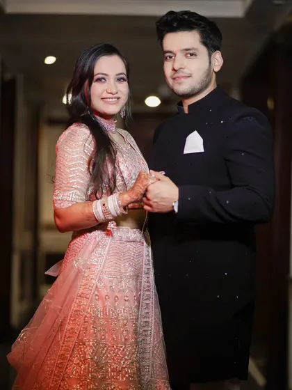 A beautiful, classic portrait of a newly engaged couple. Holding hands and smiling for the camera, this shot captures the excitement and promise of their journey ahead.