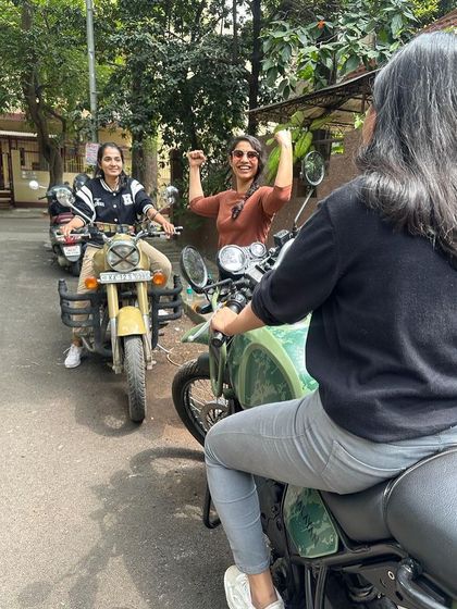 A graduate celebrates her newfound freedom. She is no longer a passenger but the captain of her own ride.