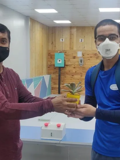 A shooter receiving a plant after participating in our monthly talent test match.
