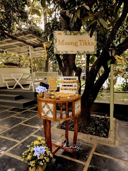 A "Maang Tikka" counter, offering beautiful floral jewelry for guests to wear during the Haldi ceremony.