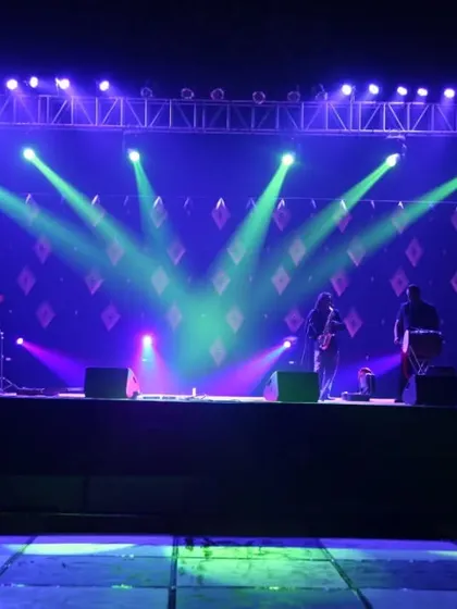 We provide professional stage and lighting solutions for concerts, corporate shows, and sangeet nights. This setup includes a full lighting truss with programmable spotlights to create a dynamic atmosphere for live performances.