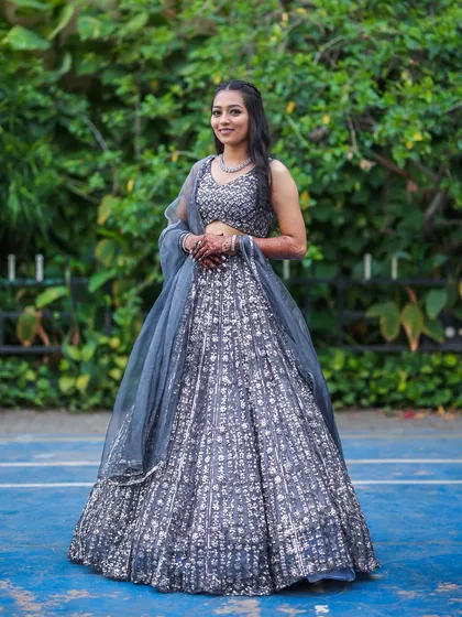 A classic pose showing the full sangeet outfit and the flawless makeup.