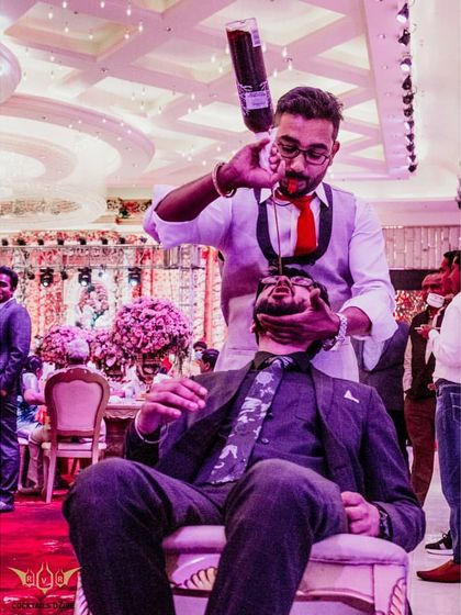 No one is safe from the fun. A guest gets a direct pour from our bartender, showing the high-energy and interactive nature of our service.