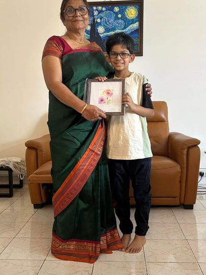 A young boy receiving one of my small floral watercolors as a gift. It's moments like these that make being an artist so fulfilling.