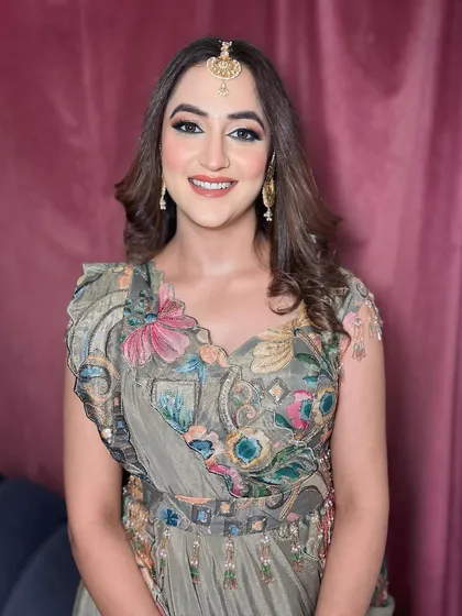 A full portrait of this gorgeous floral look. The makeup is designed to complement the colors in her outfit without being overpowering.