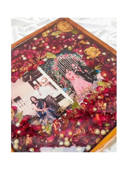These images and videos showcase various angles and the creation process of my custom wedding and anniversary varmala preservation frames. Each one is made with love to turn your special memories into a timeless treasure.