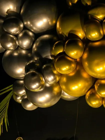 A detailed shot of the metallic balloon garland. I use high-quality chrome and metallic balloons to create a luxurious and high-impact look for elegant events.