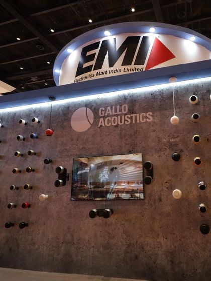 Our booth at the Smart Home Expo, featuring a "speaker wall" of Gallo Acoustics products. This display demonstrates the wide variety of colors and the visual impact these designer speakers can have when arranged as a feature wall.