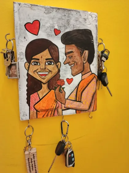 Looking for a gift that's both personal and practical? My custom caricature keychain holders are hand-painted on wood and are a unique way to organize your keys.