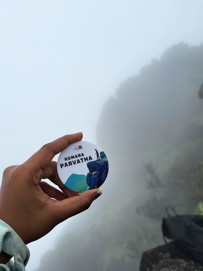 A close-up of our custom Kumara Parvatha trek badge, a souvenir to remember your incredible journey to the peak.