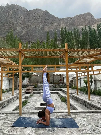 Fitness is about more than the gym; it's about what your body allows you to do and experience. Here I am holding a pincha mayurasana, or forearm stand, in the mountains of Leh. We train to make life grand.
