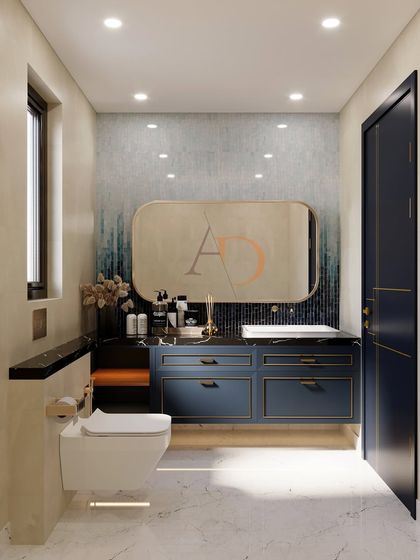 A full view of the bathroom with the navy blue vanity, showing the wall-mounted toilet and the artistic, moody ambiance created by the tiles and lighting.