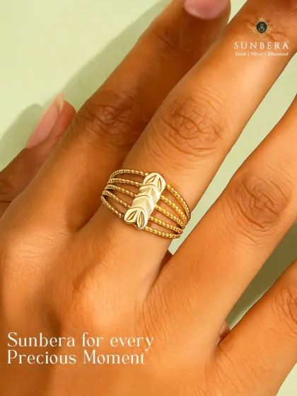 A multi-strand gold ring with a unique leaf-motif centerpiece. This piece is part of our handpicked collection for gifting, offering a stylish and precious token of affection.