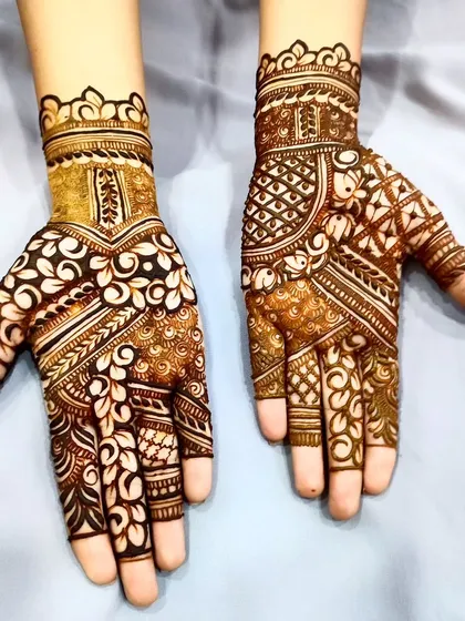 A beautiful example of using cutwork to create a "reverse" floral pattern on the back of the hand.