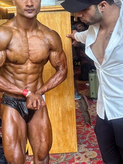 Backstage support at its finest. I'm right there with my client, making sure he is confident and ready to display the physique he worked so hard for.