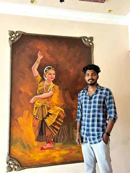 Here I am standing next to the completed Bharatanatyam wall mural. This image helps to show the large scale of the artwork and the personal pride I take in creating these culturally significant pieces.