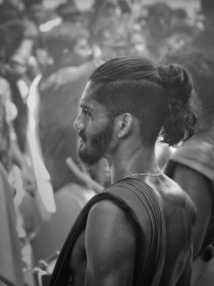 A black and white profile, capturing the focused and modern look of one of our artists.