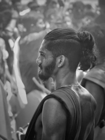 A black and white profile, capturing the focused and modern look of one of our artists.