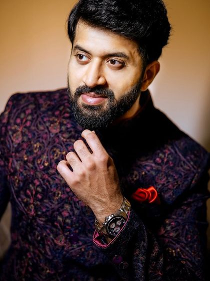 A handsome close-up portrait of the groom, Suhith, looking sharp and ready for his big day.