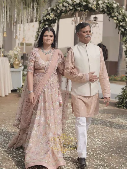 A beautiful portrait of the bride and her father during their walk down the aisle.