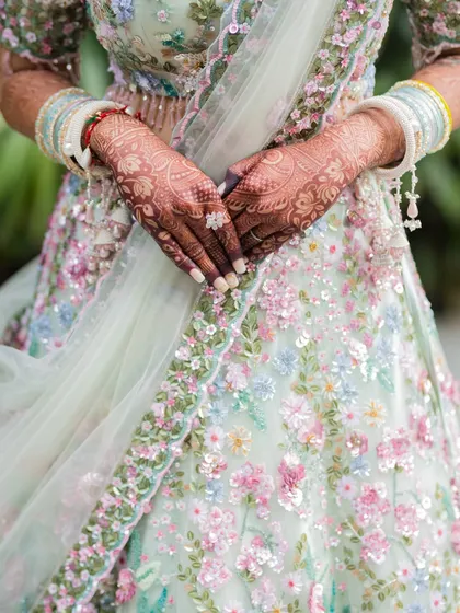 A close-up shot of the bride's intricate Mehendi. We pay attention to the small details, as they are a beautiful and important part of the wedding tradition.