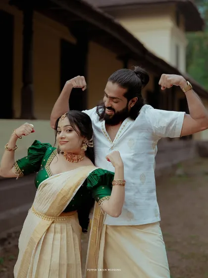A fun and quirky portrait of the couple flexing their muscles, showcasing their playful personalities and strong partnership.