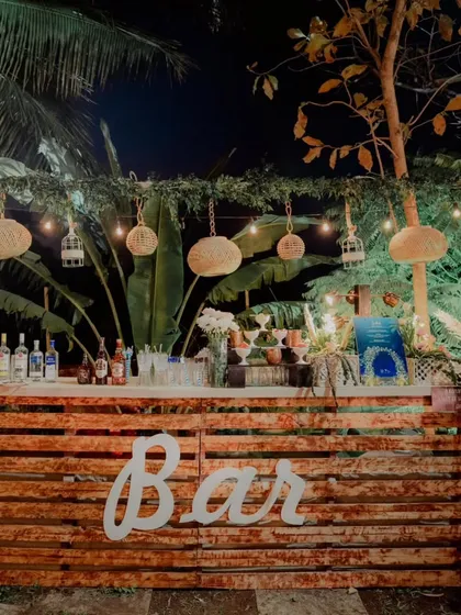 We can match any aesthetic, including this beautiful rustic bar perfect for an outdoor engagement party or a boho-themed wedding. The wooden pallet design, string lights, and natural elements create a warm and inviting atmosphere for your guests.