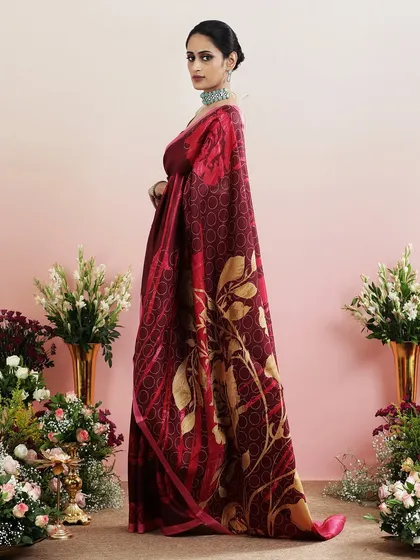 The side view of the maroon floral saree, capturing its elegance and grace.