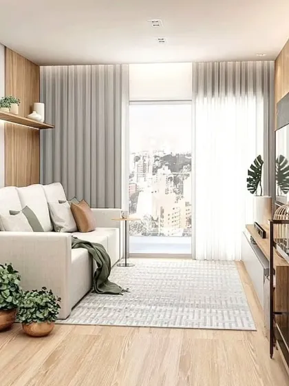 A compact living room design that is both stylish and functional. The tripod floor lamp and indoor plants add a touch of warmth and personality.