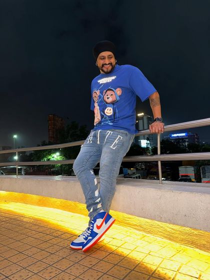 Posing outside the venue before a late-night wedding after-party. The city lights are the perfect backdrop for a night of celebration.