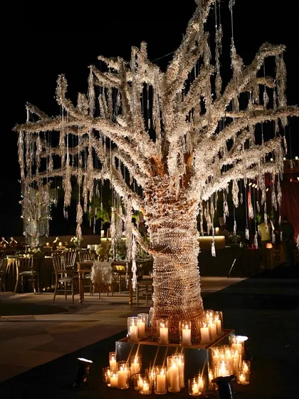 This Sangeet was all about 1920s glamour. We designed and built this stunning crystal tree as a centerpiece, which, along with thousands of candles, created a shimmering, magical atmosphere for the Gatsby-themed night.