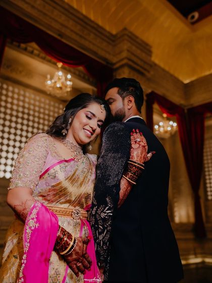 An intimate and romantic moment. The bride's soft glam makeup looks beautiful even in a close-up, candid shot.