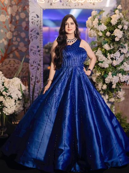 A full-length portrait of the client, looking absolutely regal in her blue ball gown.