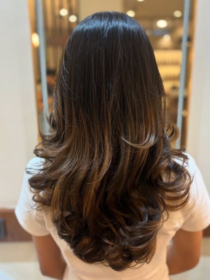 This is a great example of a low-maintenance balayage. The color is focused on the mid-lengths and ends, which means the grow-out process will be incredibly smooth.