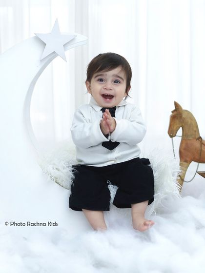 Another happy clap from our little star, showing the pure fun of the photoshoot experience.