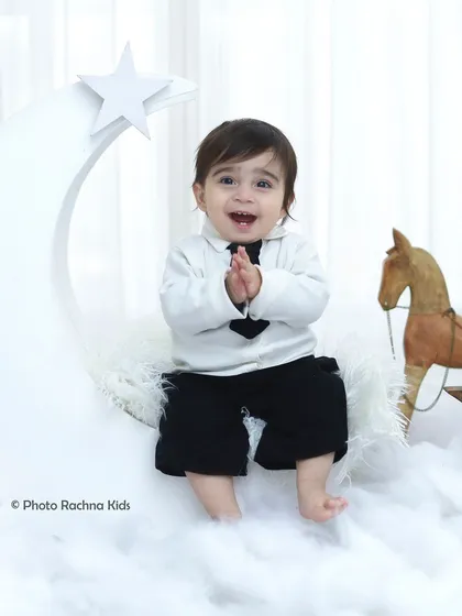 Another happy clap from our little star, showing the pure fun of the photoshoot experience.