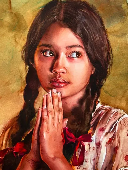 A portrait of a young girl with her hands in a prayer-like gesture, focusing on capturing innocence and a serene mood.