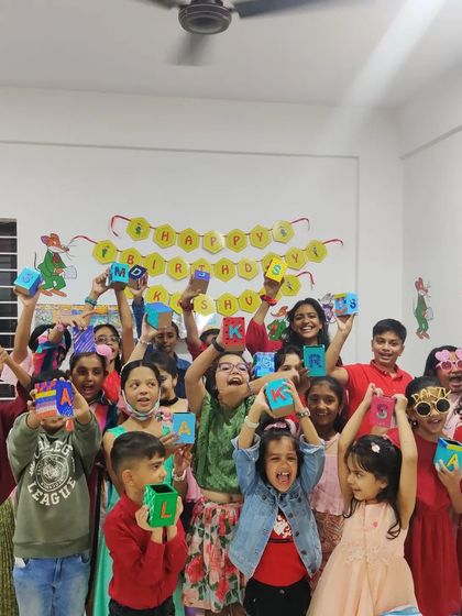 So much energy in the room! The kids are proudly showing off the personalized pen stands they made during this super fun birthday party.