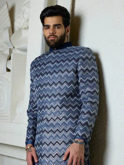 The chevron weave kurta, a piece that is both an outfit and an experience. The rich textures and heritage silhouette are crafted for those who appreciate the finer things.