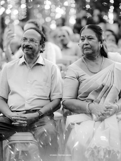 A black and white portrait of the parents watching the ceremony. Capturing the emotions of the family is just as important as focusing on the couple.